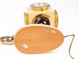 a wooden object with a camera attached to it