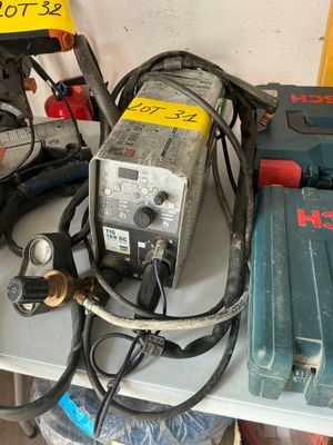 a lot of tools on a table with a price tag