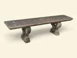 a stone bench that is sitting on top of a table