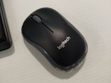 a black mouse and a black keyboard on a white table
