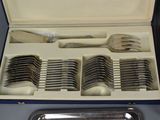 a box with a set of forks and spoons in it