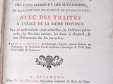 an old book that is open on a table