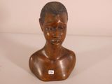 an image of a wooden busturine of a boy with a black hair