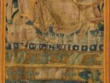 a large tapestry hanging on the wall in a room