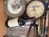 a box full of wine bottles and a clock in it