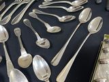 a lot of spoons and spoon spoons on a table