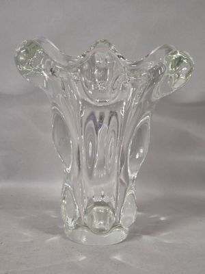a glass vase that is sitting on a table