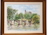 framed watercolor painting of a bridge over a river with a castle in the background