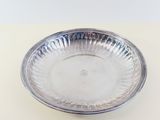 a silver plate that is sitting on a table