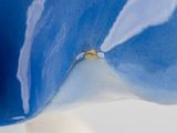 a close up of a blue and white bowl with a spoon in it