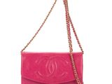 a pink chanel bag with a chain strap