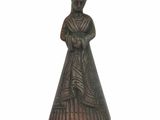 figurine in the form of a woman in a dress