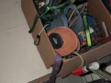 a box full of assorted items sitting on the floor