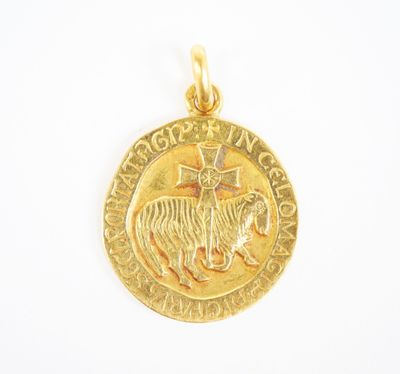 a close up of a gold coin with a tiger on it