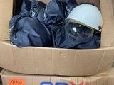 a cardboard box with a helmet in it on a table