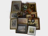 a lot of framed pictures and a clock on the wall
