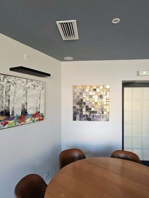 an image of a conference room with a table and chairs