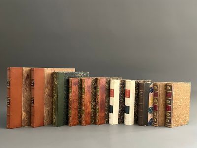a group of books sitting on top of each other on top of a table