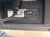 a close up of a laptop with a cable connected to it