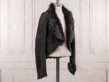 a black jacket with a fur collar on a mannequin mannequin