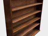 a close up of a wooden bookcase on a white background