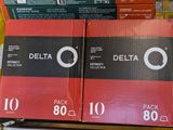 two boxes of delta cigarettes are stacked on a shelf in a store