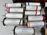many rolls of paper that are sitting on a table