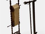 pair of antique wooden clothes racks with a towel rack on top