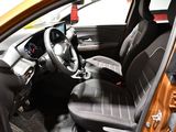 the interior of a car with a steering wheel and a dashboard