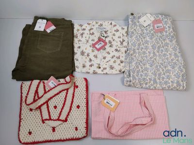 four pieces of clothing are laid out on a table
