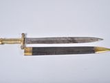 pair of two old and worn swords on a white surface