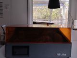 a large 3d printer sitting on a table in a room