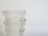 a glass vase that is sitting on a table