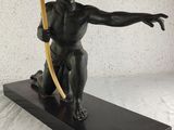 statue of a boy with a bow and arrow on a black base