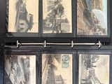 a black binder with a bunch of old photos on it