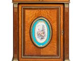an antique clock with a picture of a woman on it