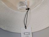 a white hat that has a tag on it