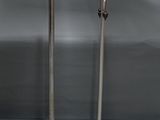 pair of silver plated candlesticks on stand on grey background