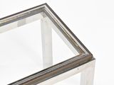 a glass table with a metal frame on top of it