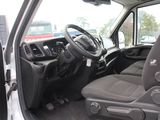 the interior of a white van with the driver ' s seat up