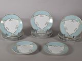 six blue and white plates with hearts on them sitting on top of each other