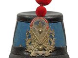 a black and blue hat with a red pom pom on top of it
