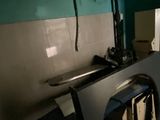 a kitchen with a stove and a microwave in it