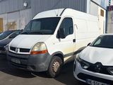 a white van parked next to other cars in a parking lot
