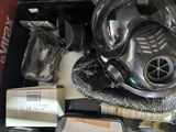 a picture of a gas mask and other items on a table