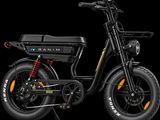 a close up of a black electric scooter on a black background