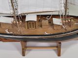 a model of a sailboat on display on a table