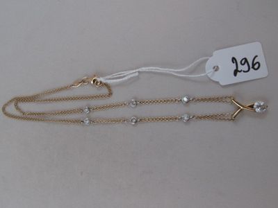 a close up of a necklace with a tag on it