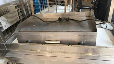 a large fryer that is sitting in a kitchen