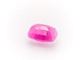 a pink sapphire stone on a white background